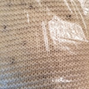 A wrap beige with black threads